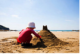 illustration: child making a sandcastle