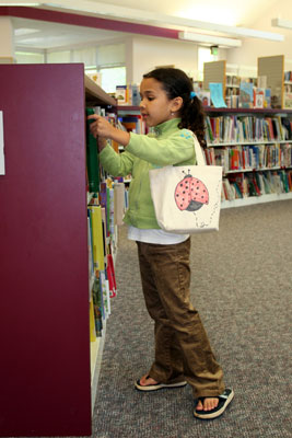 girl-in-library-putting-away-books-USE-THIS-ONE.jpg